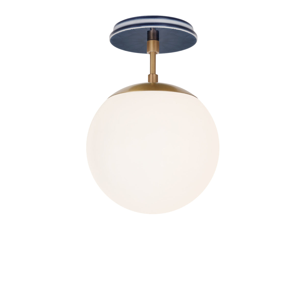 Alto Surface 8" shown in Heirloom Brass with an Indigo Blue Star Ceramic Canopy