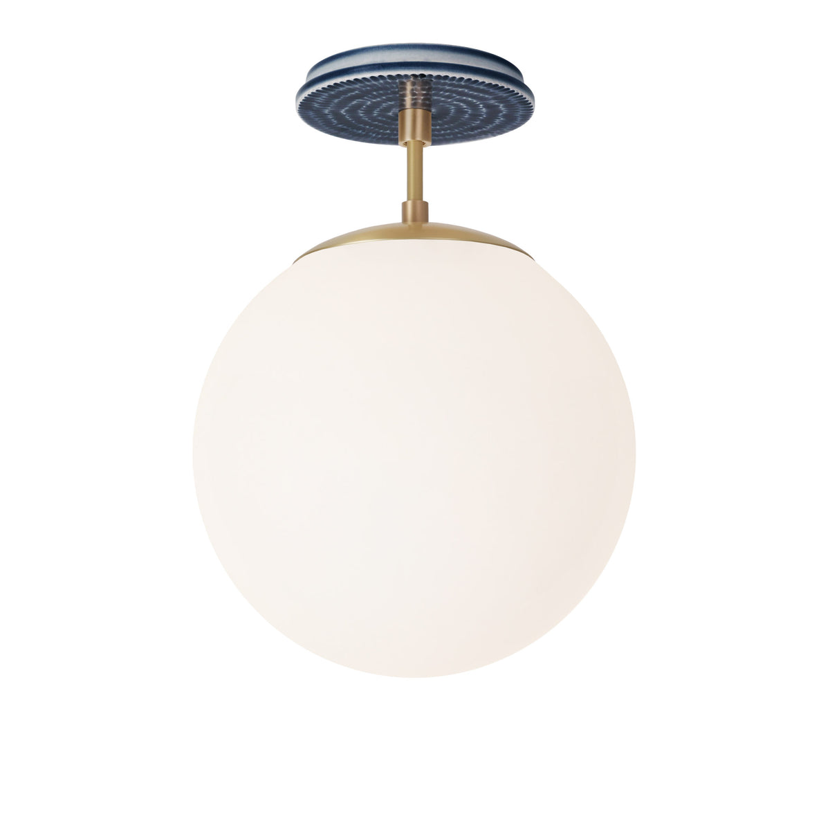 Alto Surface 10” shown in Brass with an Indigo Blue Sunflower Ceramic Canopy
