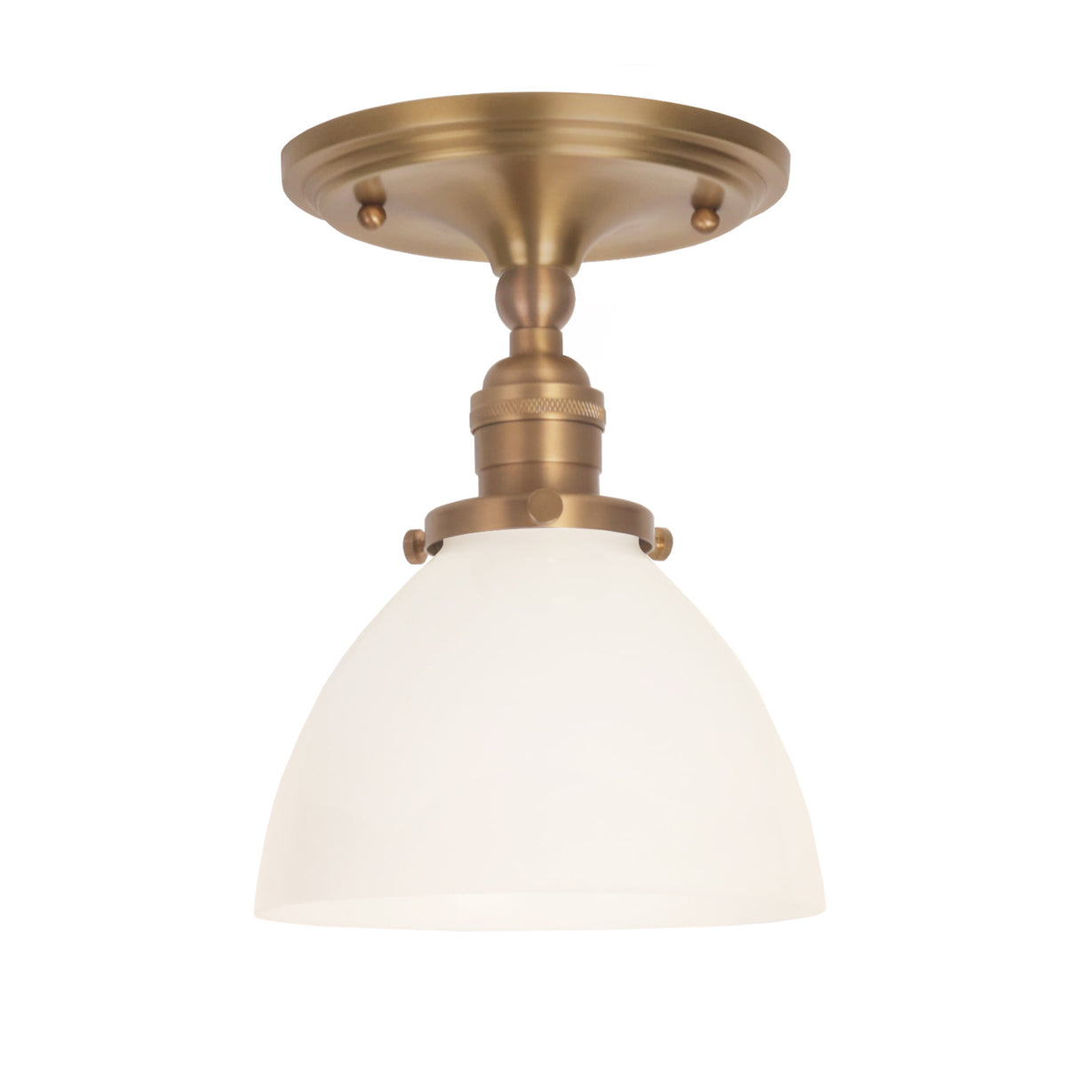 Grace Surface shown in Heirloom Brass with an Opal Glass shade
