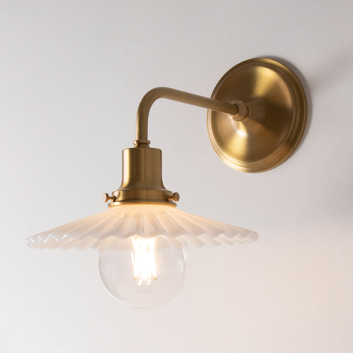 Marjorie Demi Sconce shown in Heirloom Brass