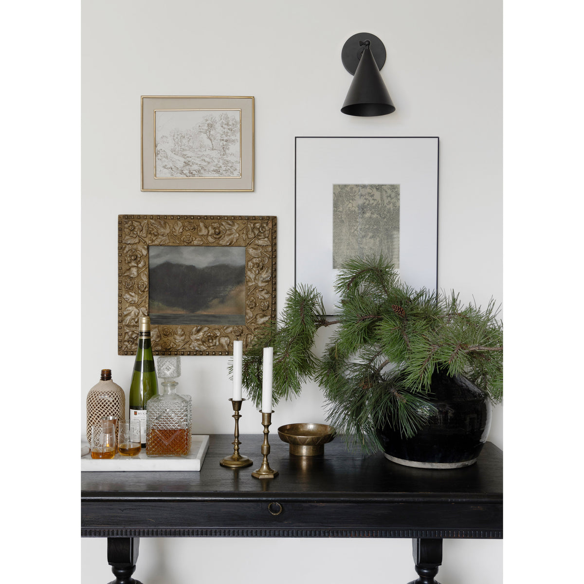 Petra Sconce shown in Matte Black with a 3" arm