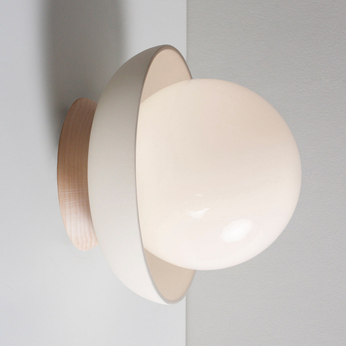 Terra Lexi shown in Bone ceramic and Maple wood canopy