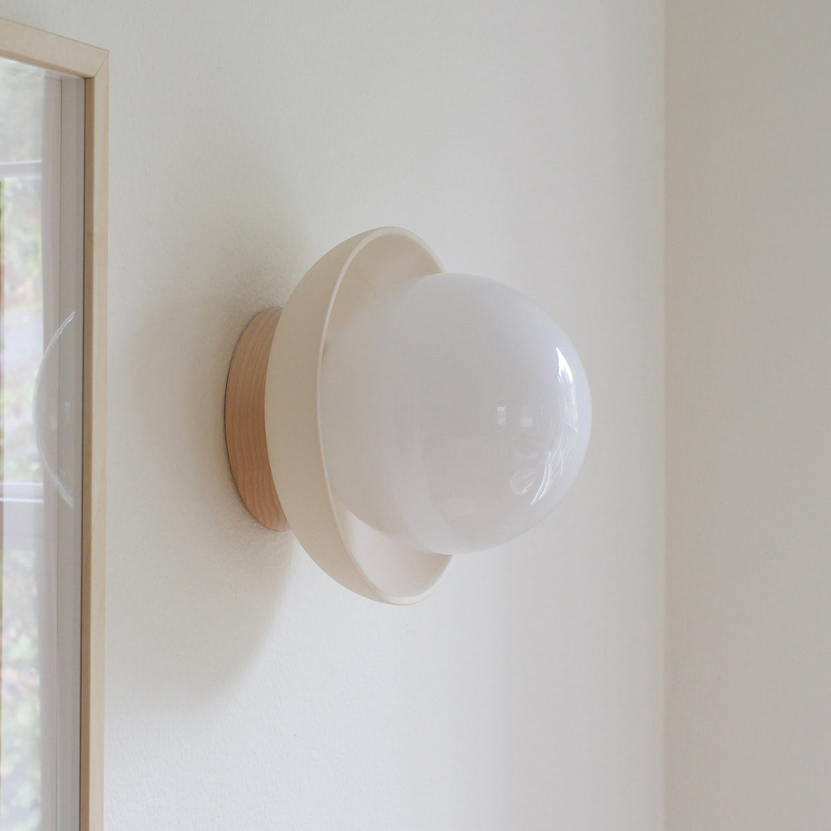 Terra Lexi shown in Bone ceramic and Maple wood canopy