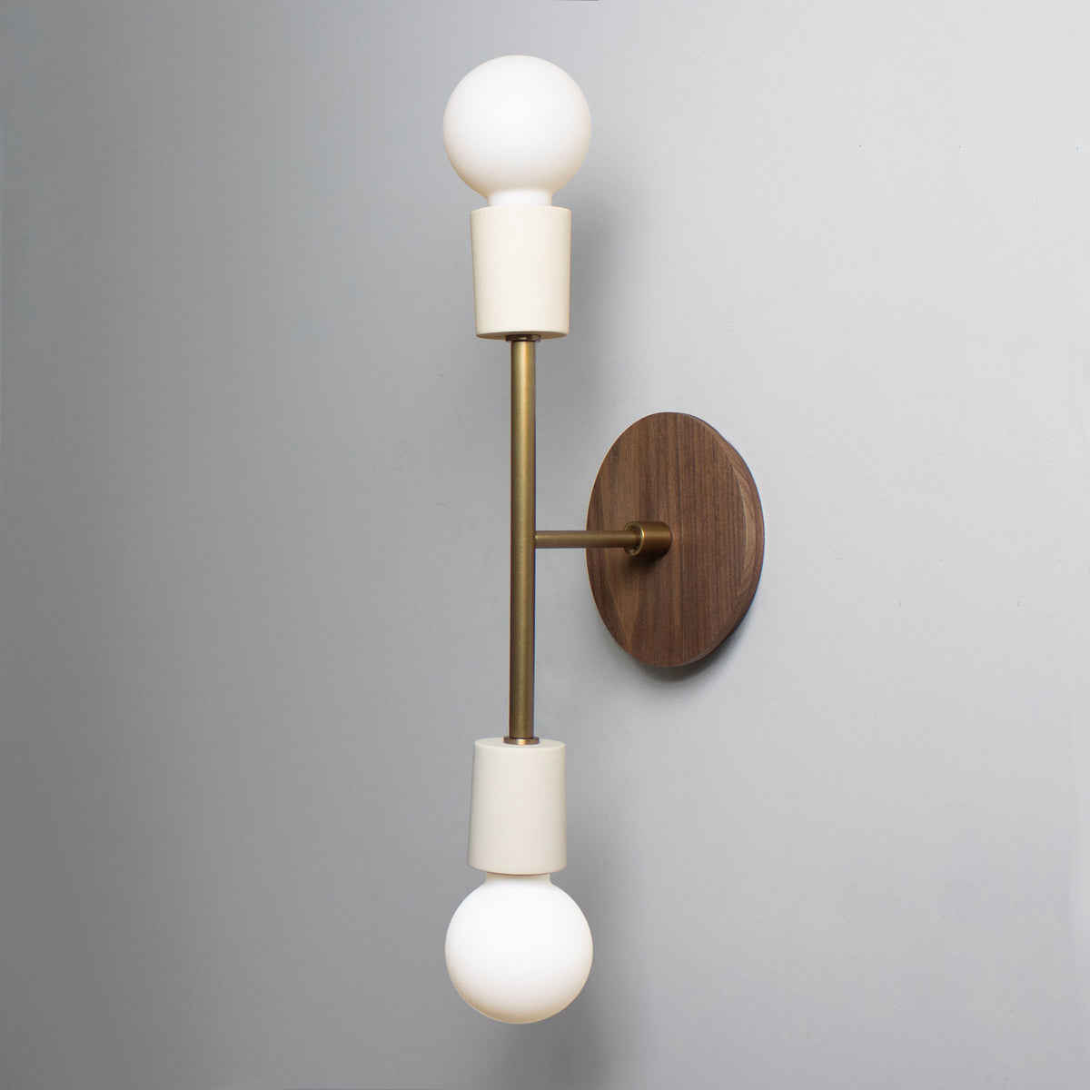 Verona shown in Bone ceramic finish with Heirloom Brass metal with Walnut canopy
