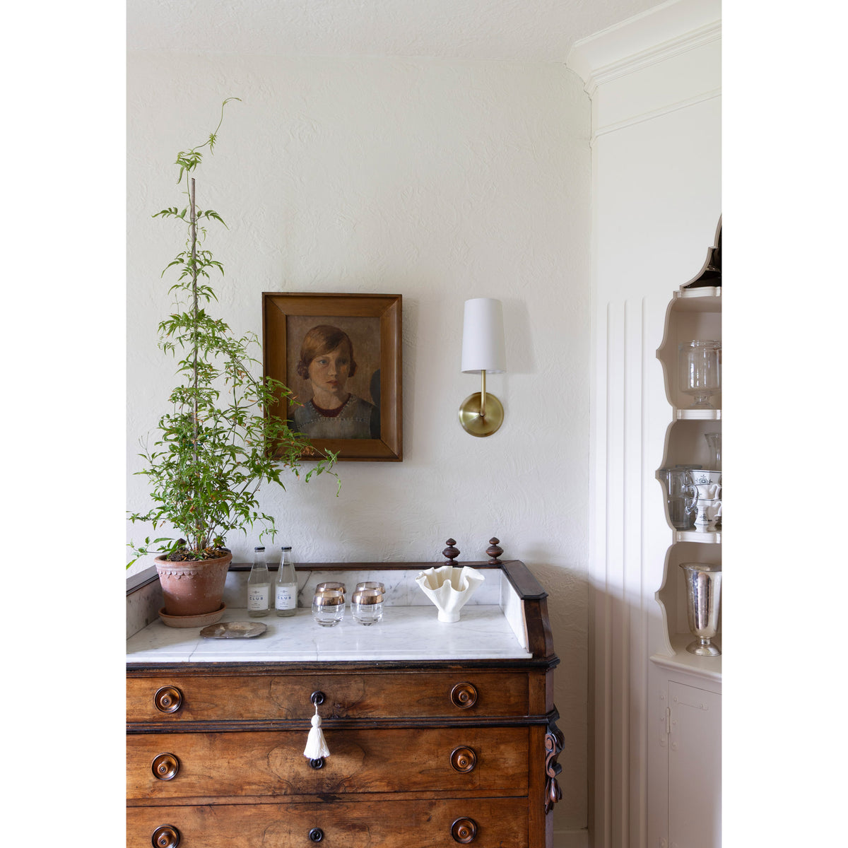Bijou Linen Sconce shown in Brass. Interior design by Sarah J. Meyer Design