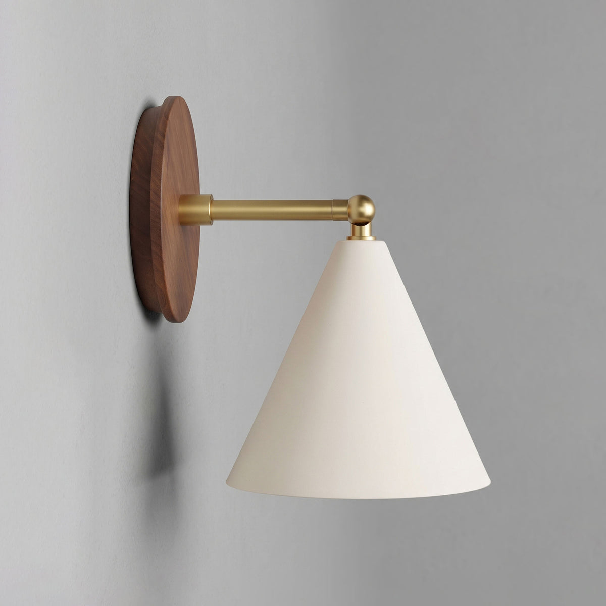 Petra Ceramic Sconce shown in Heirloom Brass with a 3" rod and Walnut Wood canopy