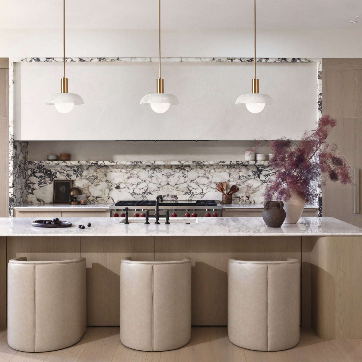 Lexi Large Pendant shown with White Perforated Shade Finish and Heirloom Brass Fixture Finish