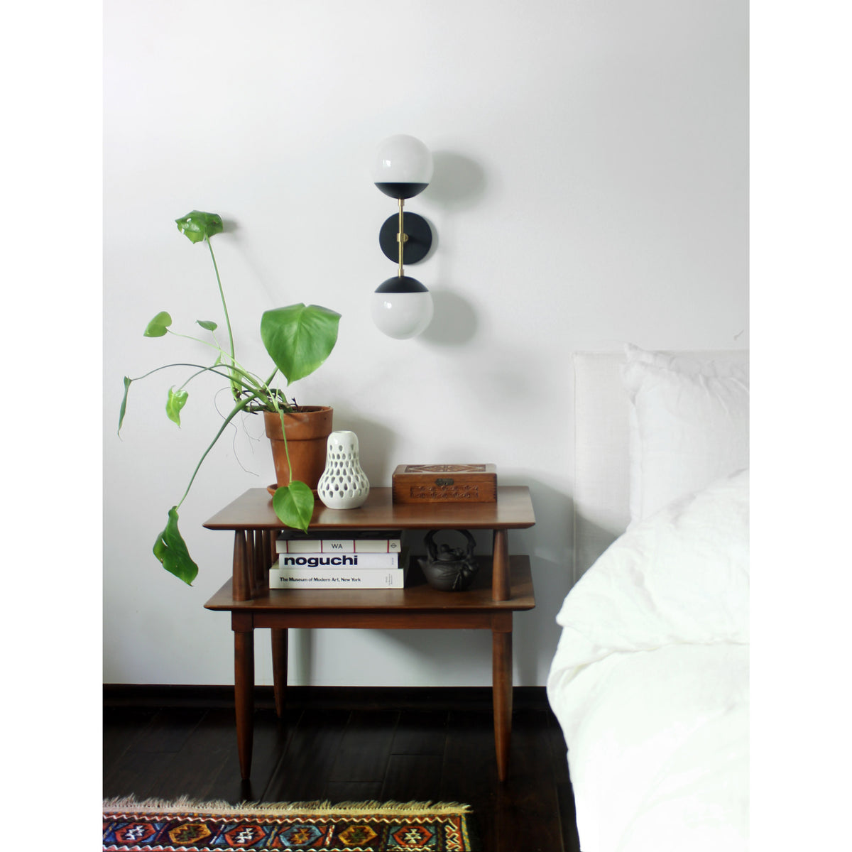 Theo shown in Matte Black and Brass with Opal 6" globes