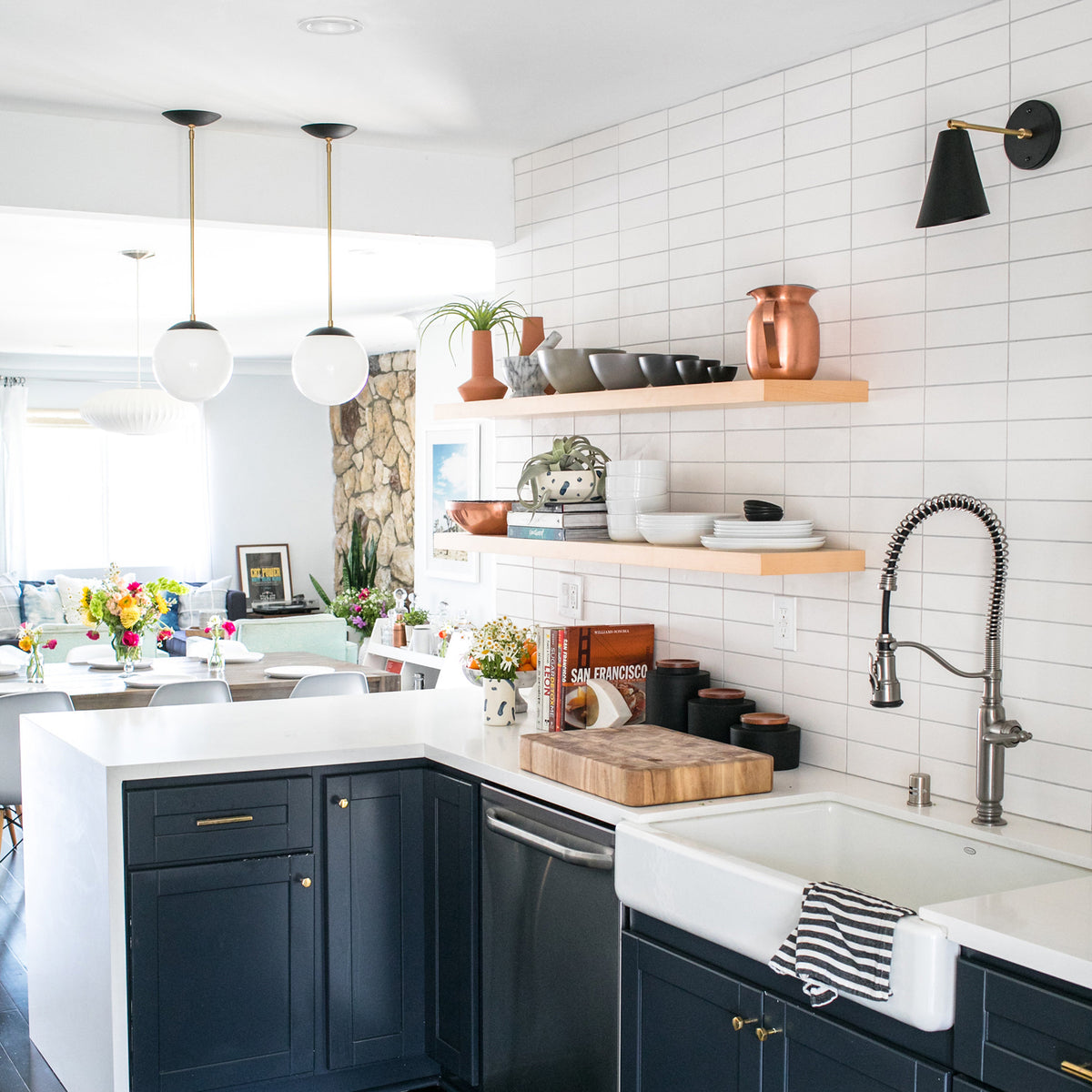 Tilt Cone shown in Matte Black and Brass. Interior design by Jillian Clark of @100_layercake. Photo by Scott Clark