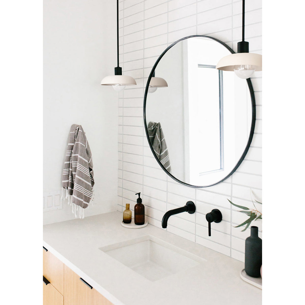 Terra Pendant shown in Bone ceramic finish with Matte Black metal. Interior Design by Jen Pinkston. Photo by Katie Jameson