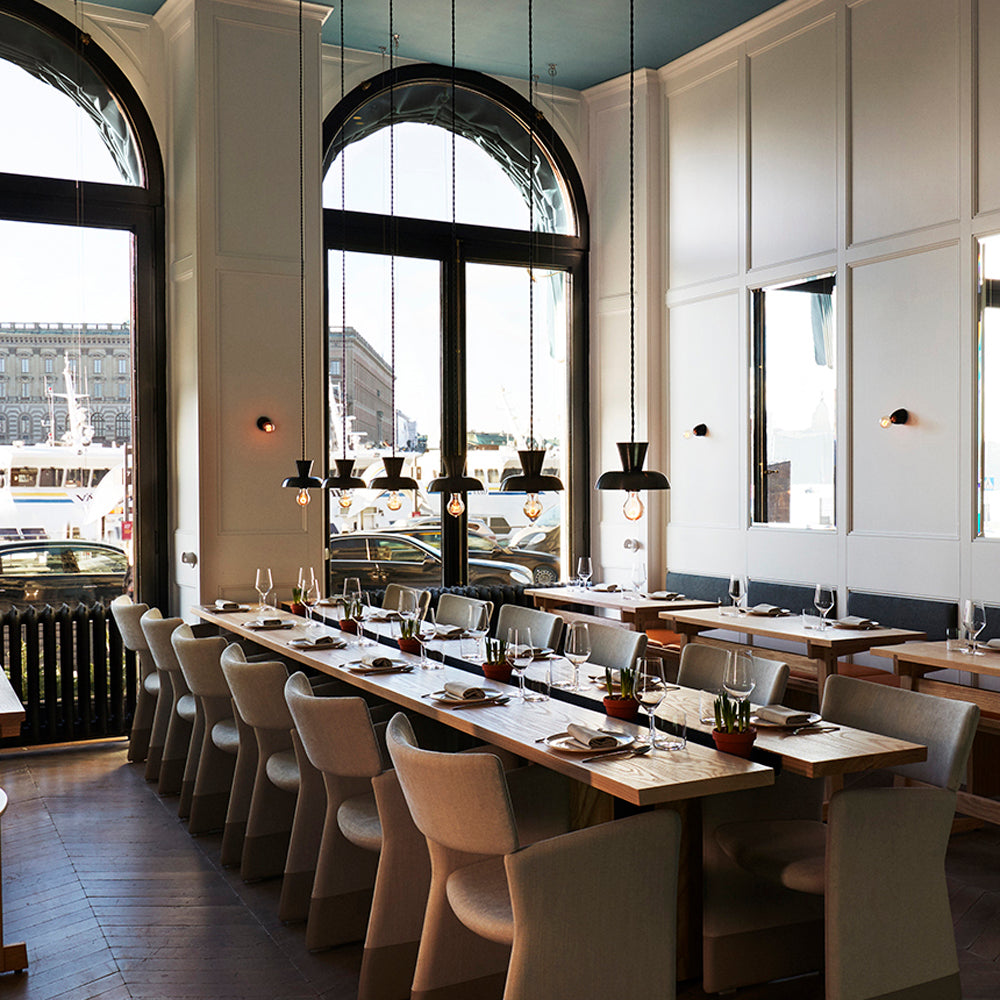 Isle Rod Pendant shown in Graphite Patina. Interior design by Eye Design