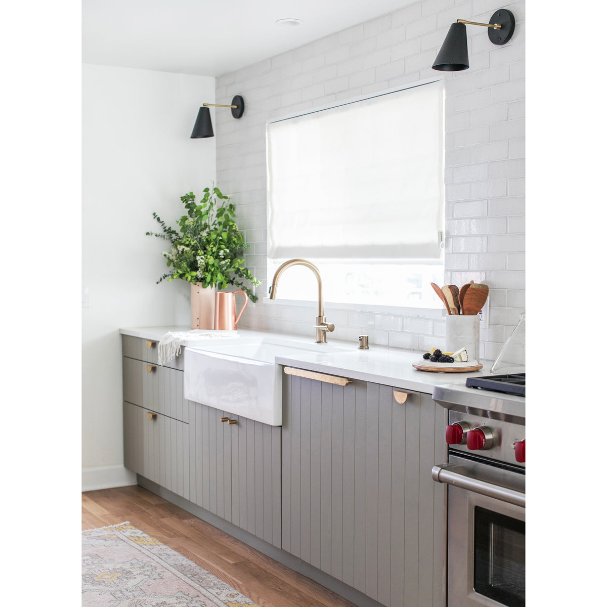 Tilt Cone shown in Matte Black and Brass finish with a 6" arm. Interior design by Sarah Sherman Samuel for Sugar and Charm Studio