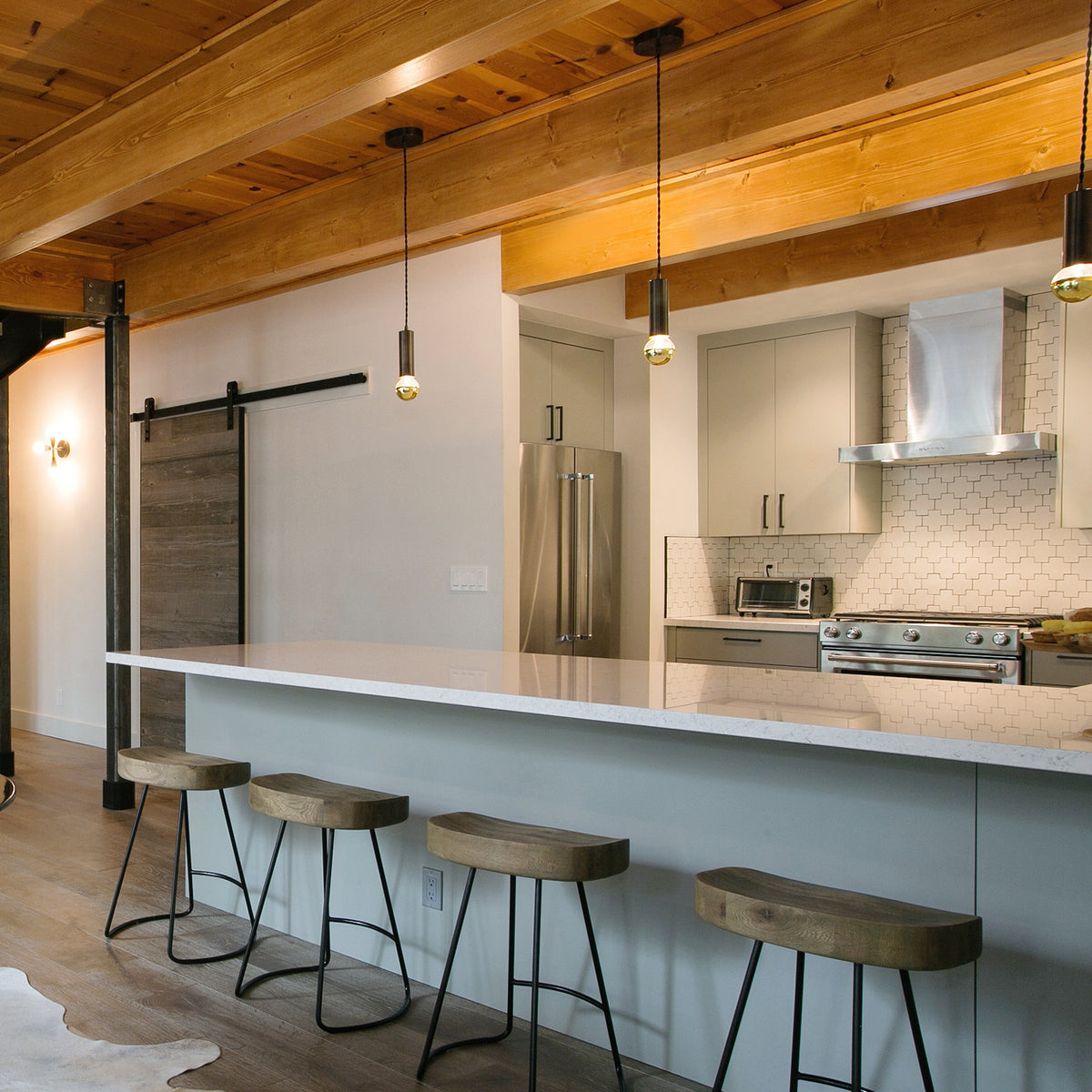 Fjord Cord Pendant shown in Matte Black with Black Vinyl Cord. Interior Design by Shirley Parks Design. Photo by Chris Beck