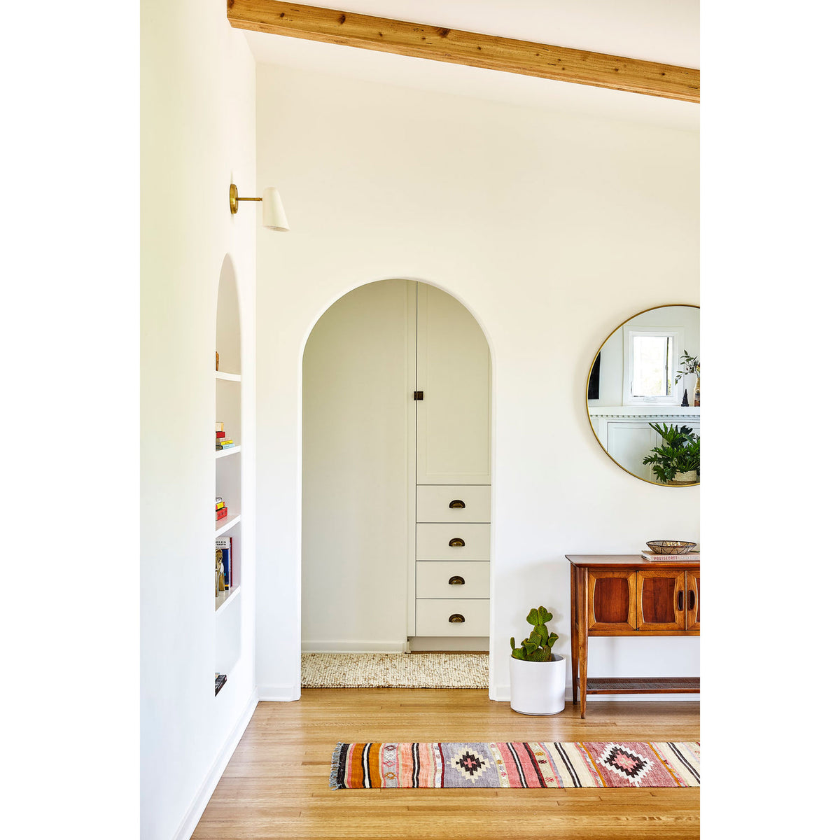 Wildwood shown in White with Brass canopy and arm. Interior Design by Byrdesign. Photo by Heidi's Bridge