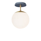 Alto Surface 8" shown in Brass with an Indigo Blue Sunflower Ceramic Canopy