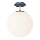 Alto Surface 12” shown in Heirloom Brass with an Indigo Blue Sunflower Ceramic Canopy