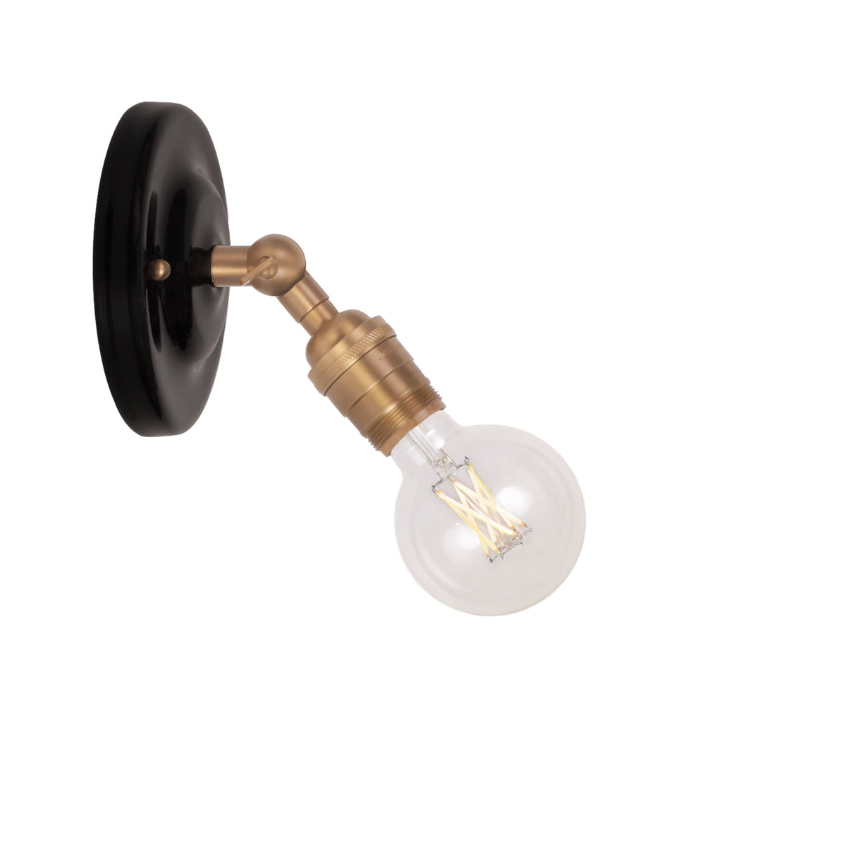 Grace Flush Sconce shown in Heirloom Brass with a Gloss Black Ceramic canopy and no shade