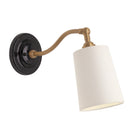 Grace Linen Sconce shown in Heirloom Brass with a Gloss Black Ceramic canopy