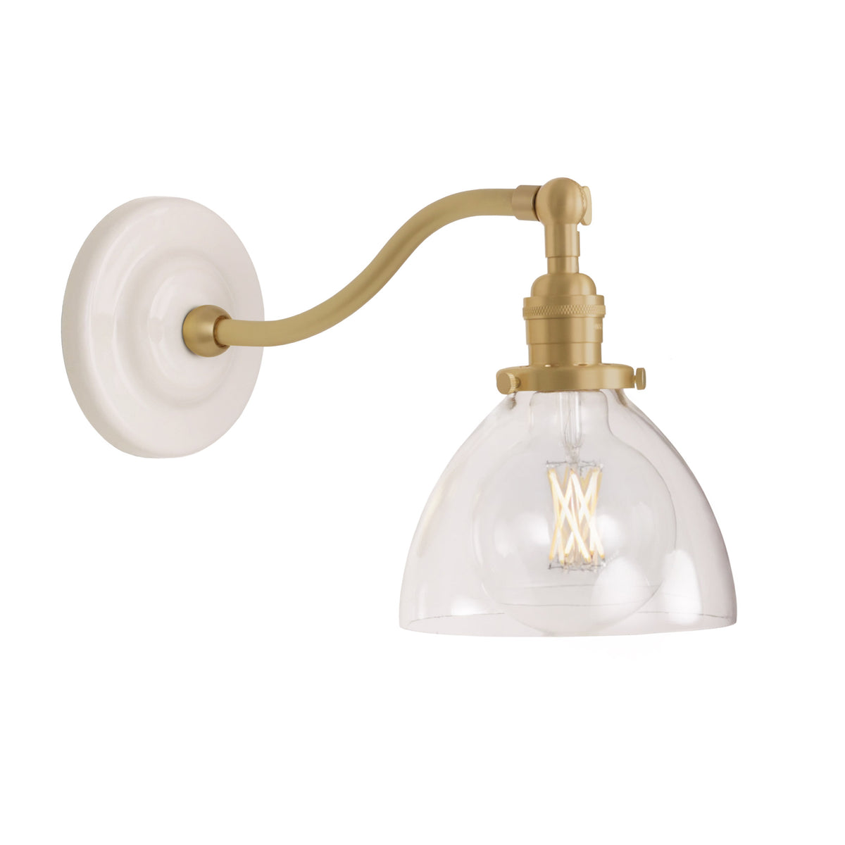 Grace Sconce shown in Brass with a Gloss White Ceramic canopy and a Clear Glass shade
