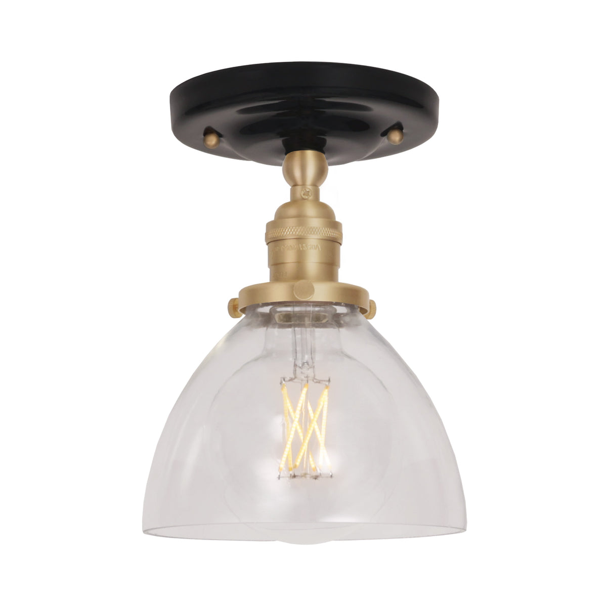 Grace Surface shown in Brass with a Gloss Black Ceramic canopy and Clear Glass shade