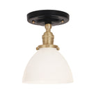 Grace Surface shown in Brass with a Gloss Black Ceramic canopy and Opal Glass shade