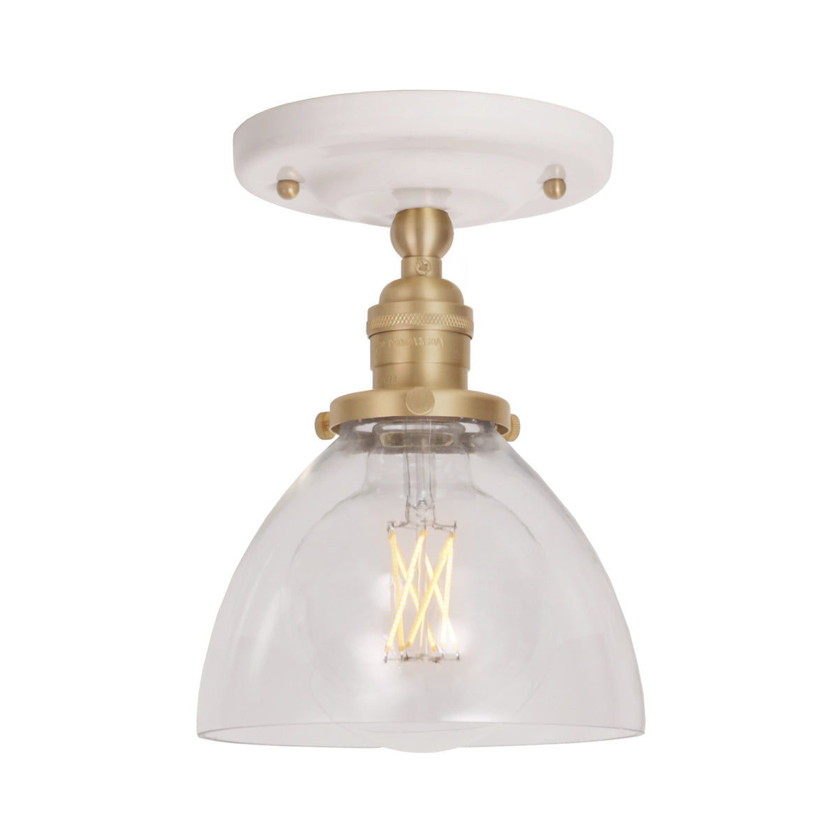 Grace Surface shown in Brass with a Gloss White Ceramic canopy and Clear Glass shade