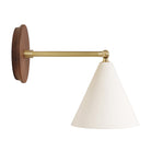 Petra Ceramic Sconce shown in Brass with a 6" rod and Walnut Wood canopy