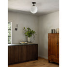 Bijou Candle shown in Graphite Patina with a Sorbonne Surface 12" Globe