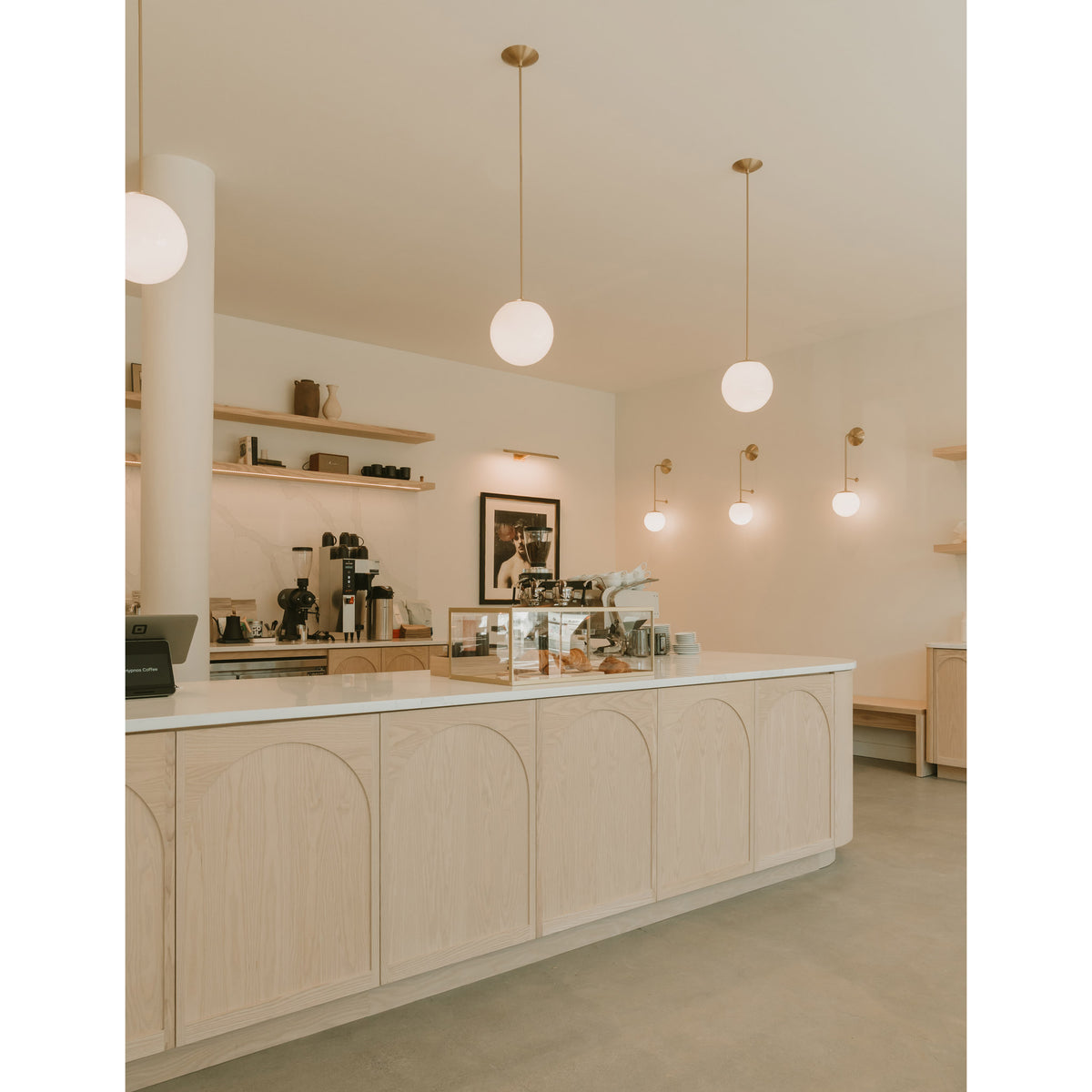 Alto Rod 10" Pendants and Ramona 8" Sconces in Brass. Hypnos Coffee interior by Fieldwork Design, Photography by Absence Studio