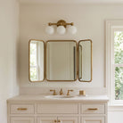 Eleanor Triple shown in Heirloom Brass