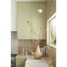 Marie Petite Sconce shown in Brass. Interior Design by Design Assembly