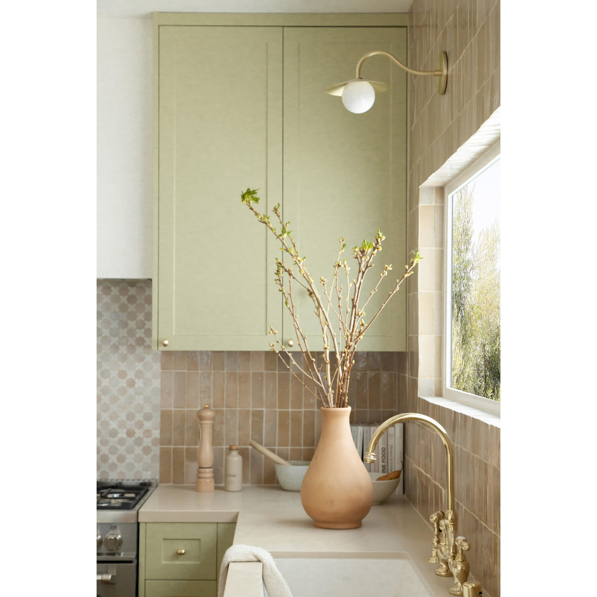 Marie Petite Sconce shown in Brass. Interior Design by Design Assembly