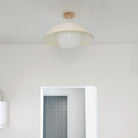 Maru Surface with a Natural shade shown in White with a Maple Wood canopy
