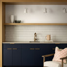 Tilt Cone shown in White and Brass. Interior design by Alykhan Velji Design