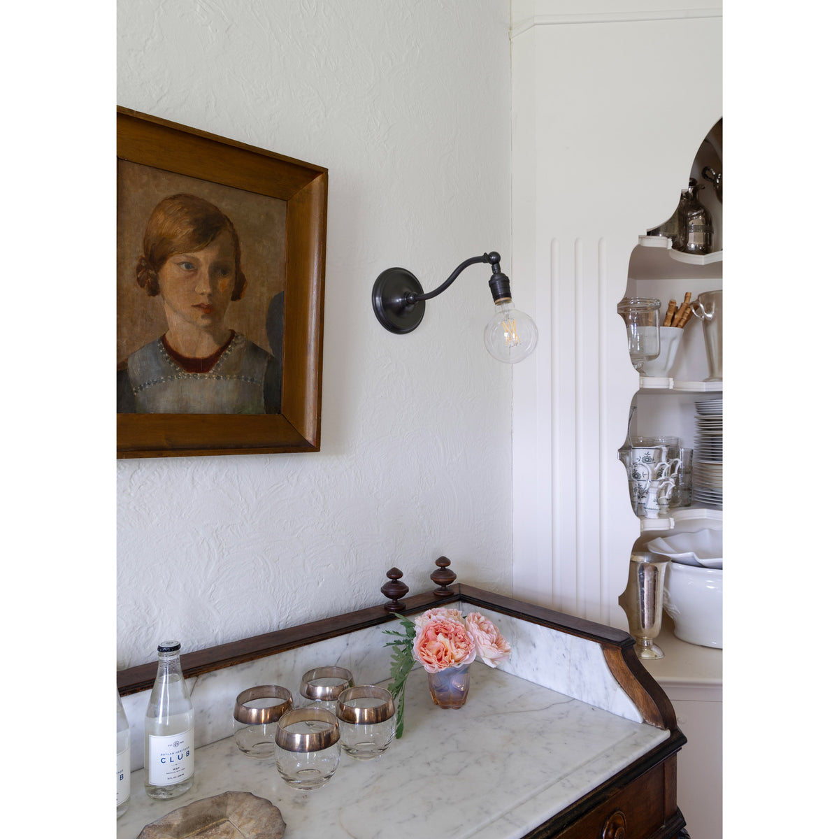 Grace Sconce shown in Graphite Patina with no shade and a G30 Filament Bulb. Interior design by Sarah J. Meyer Design