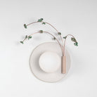 Ikebana Sconce shown in Natural White Glaze with Verdigris flower finish and Right mounted vase