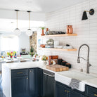 Tilt Cone shown in Matte Black and Brass. Interior design by Jillian Clark of @100_layercake. Photo by Scott Clark