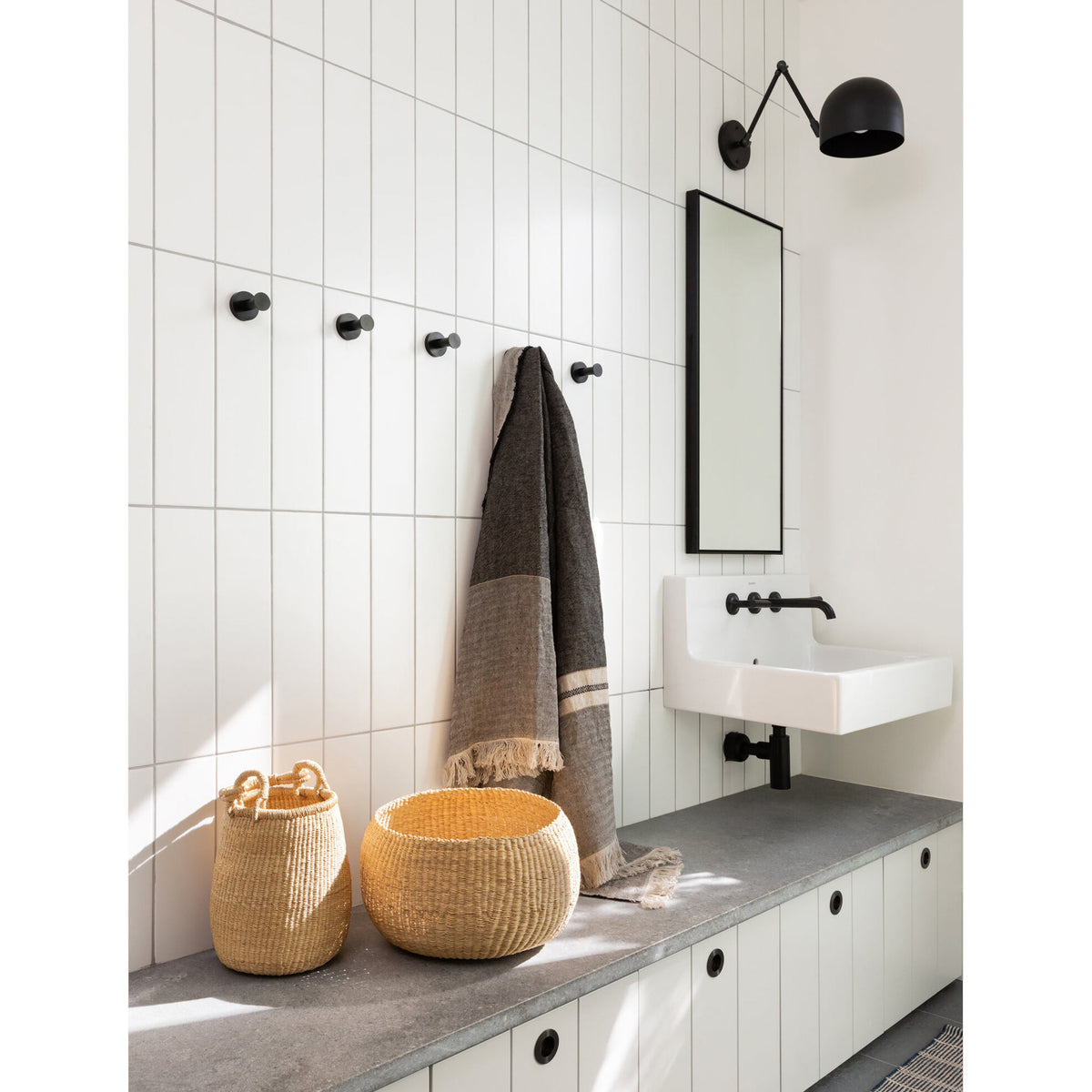 Amélie Double Articulated 8" shown in Matte Black with Graphite Patina Accents. Interior design by Sophie Burke Design. Photo by Ema Peters