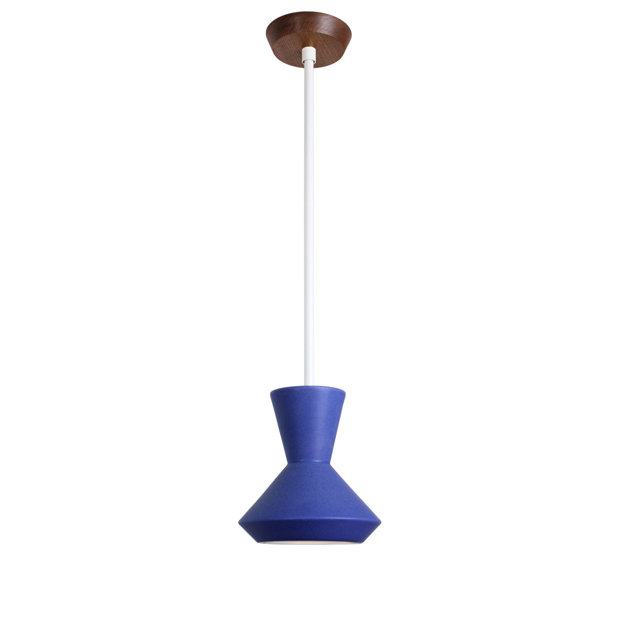 Bobbie Rod Pendant shown in Cobalt Blue Glaze ceramic with a White Metal finish and a Walnut canopy