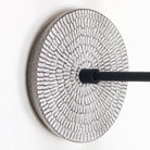 Sunflower canopy pattern shown in Brownstone White Ceramic with a Matte Black arm
