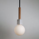 Seneca Pendant shown in Walnut with Matte Black