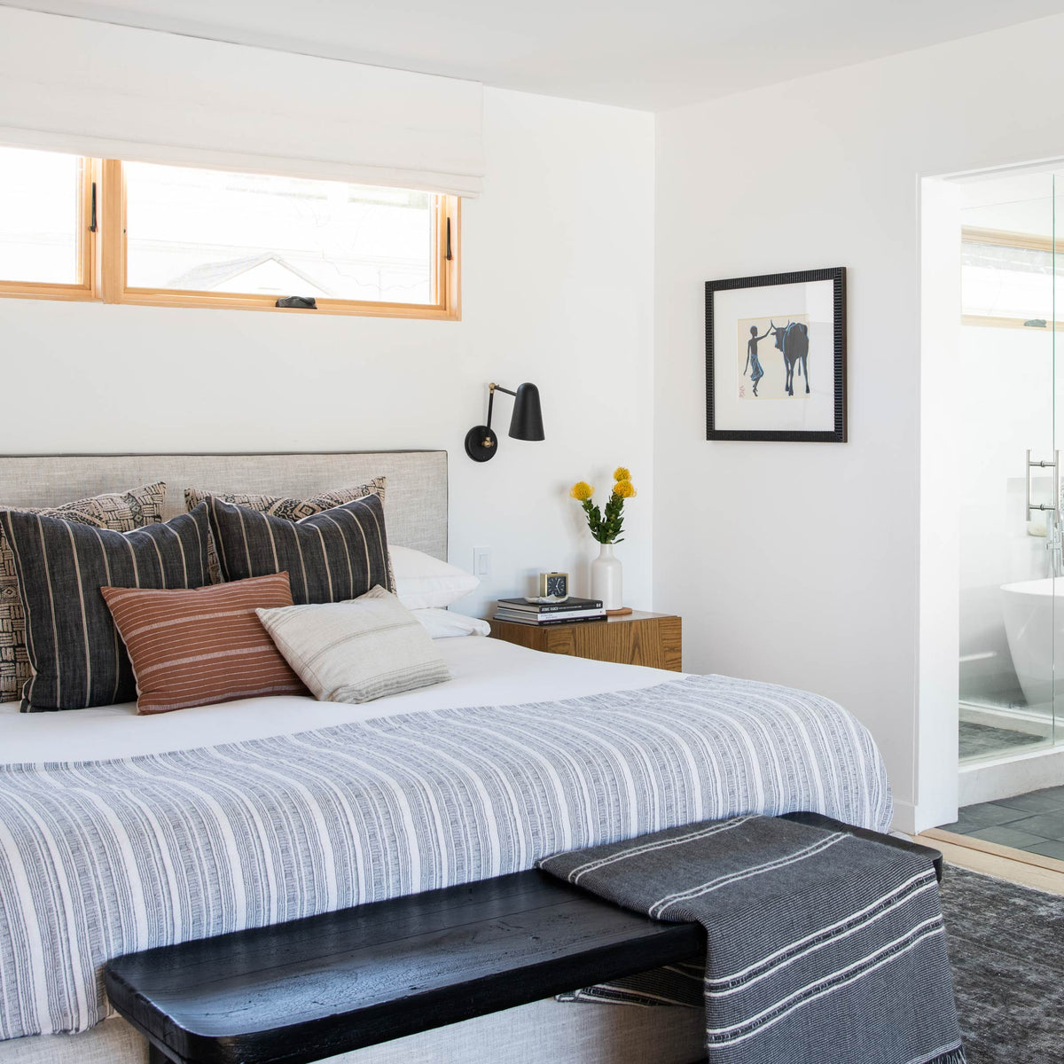 Wildwood Double Articulated in Matte Black with Brass Accents. Interior Design by Carly Waters. Photo by Tessa Neustadt