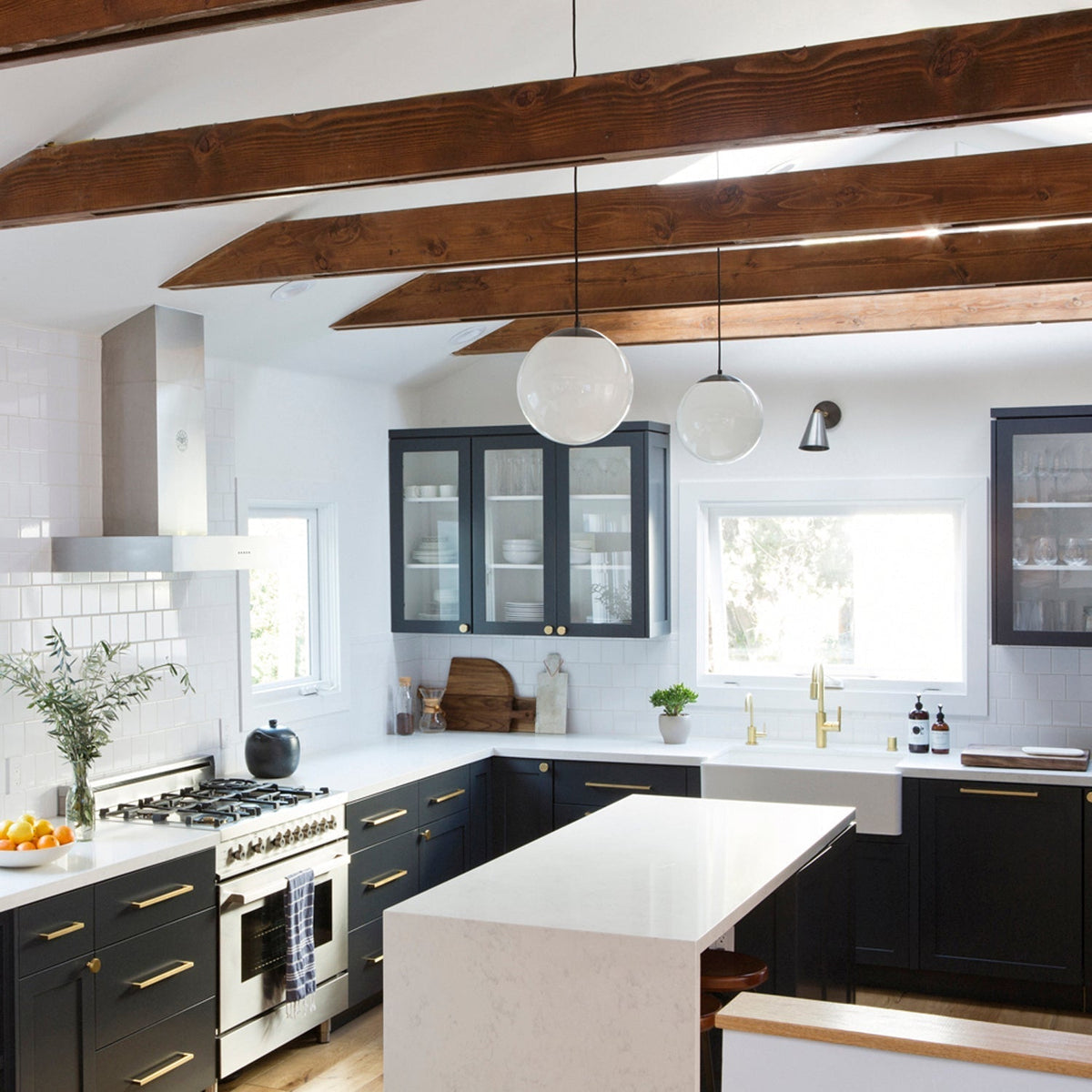 Alto Rod 12" for Vaulted Ceiling shown in Graphite Patina with Opal 12" globes. Interior design by Carly Waters. Photo by Vivian Johnson