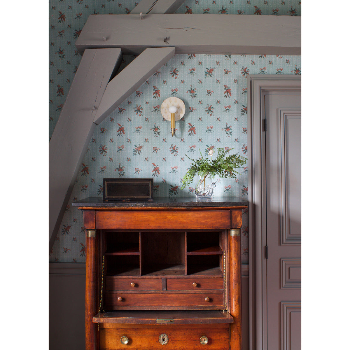 Edith ADA Sconce shown in Heirloom Brass with a Natural White and Cream Floral Ceramic Canopy