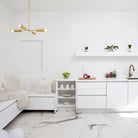 Fjord Compass for Vaulted Ceiling shown in Brass. Interior design by Gloria Sanchez. Photo by Kiritin Beyer