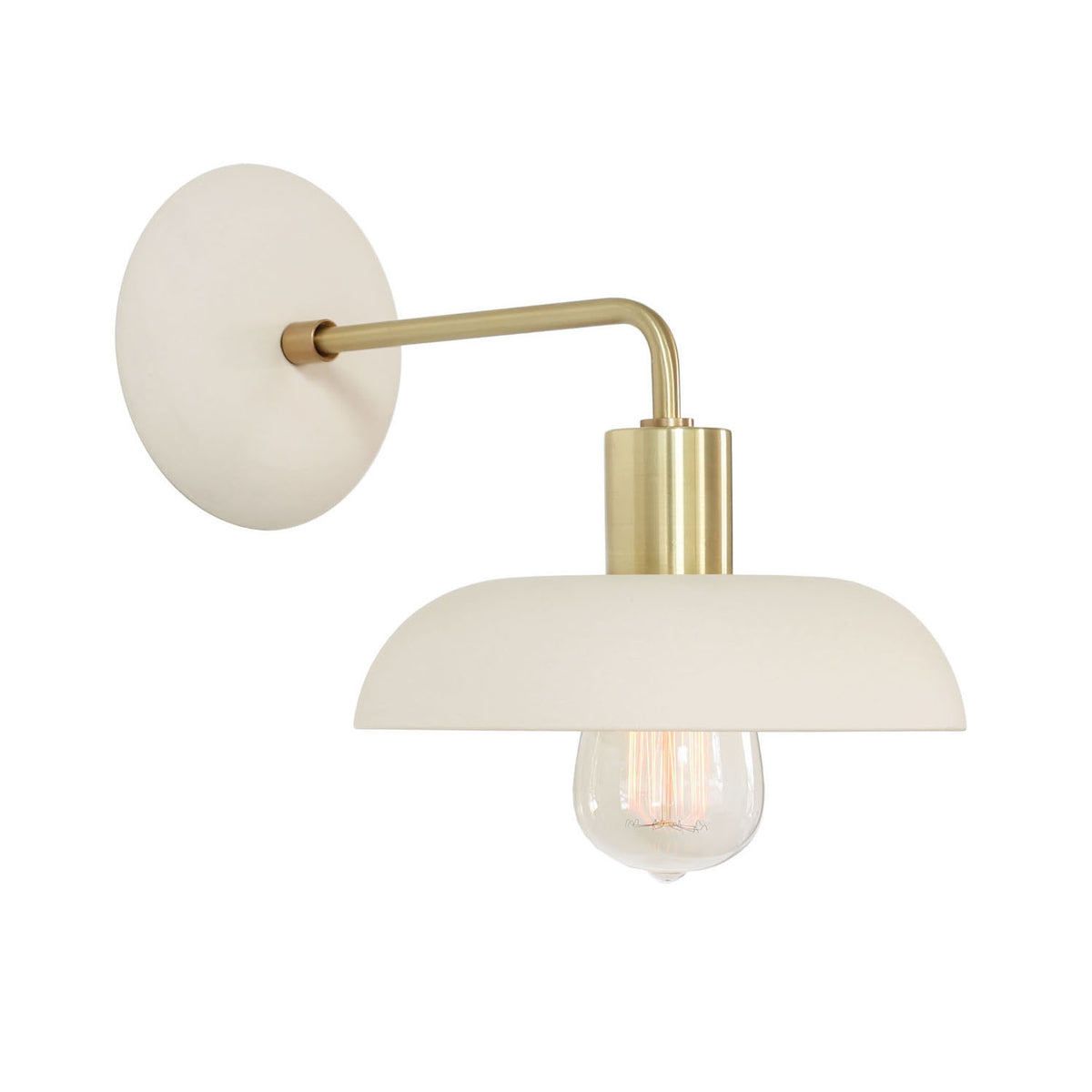 Terra Sconce shown in Bone ceramic finish with Brass metal