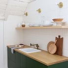 Timberline Surface shown in Brass. Interior Design by Sarah Sherman Samuel for Smitten Studio